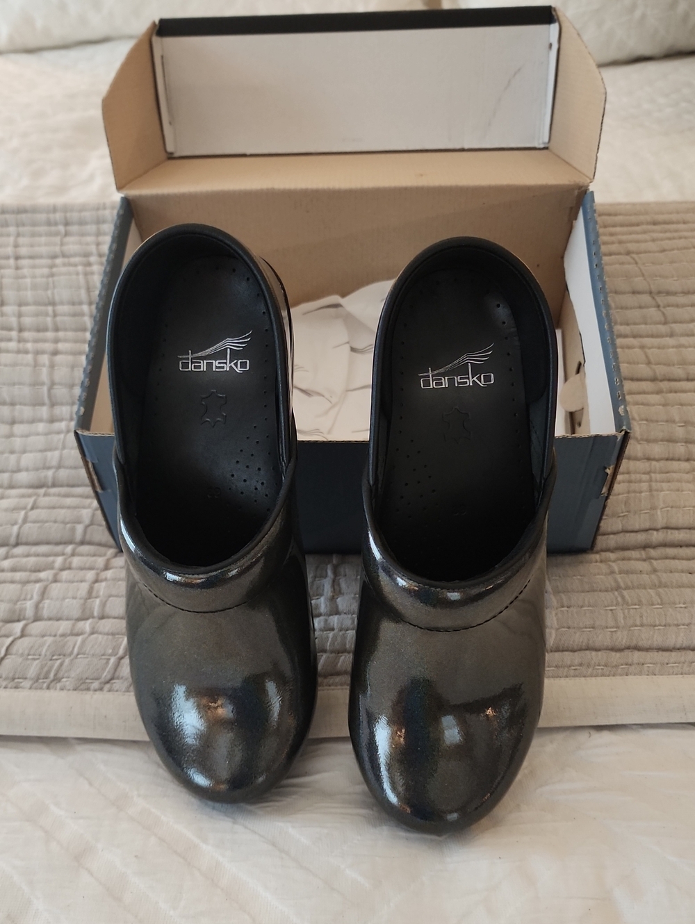 Dansko Metallic Black Patent Clogs